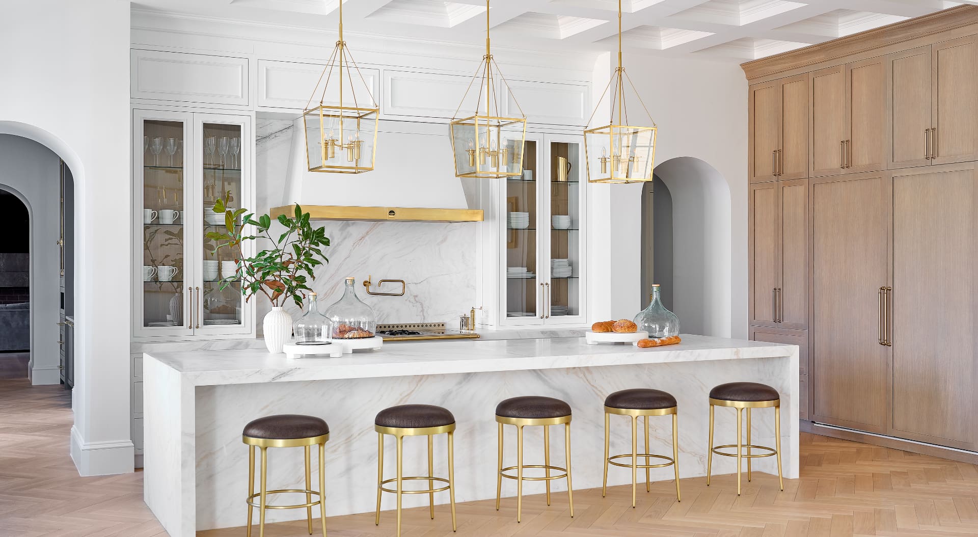 Luxury kitchen with marble island and gold fixtures
